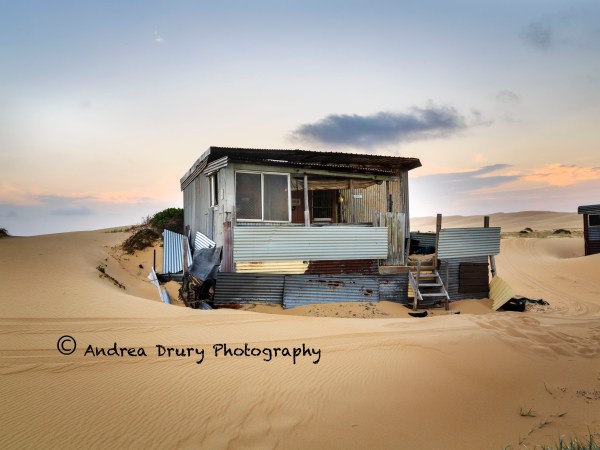 a truck that is sitting in the sand