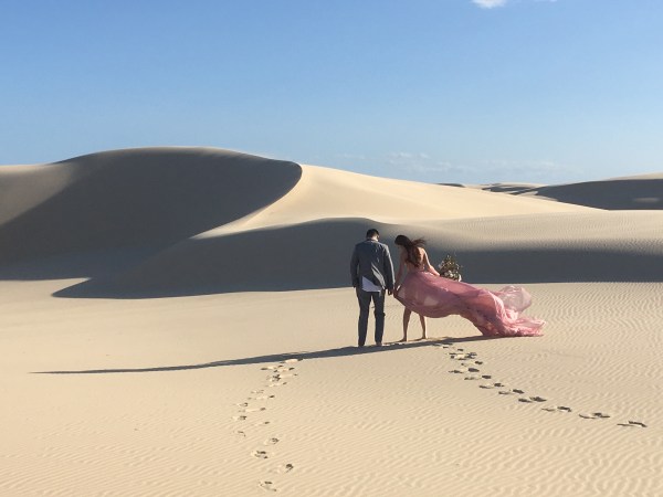 a person riding a horse on a beach